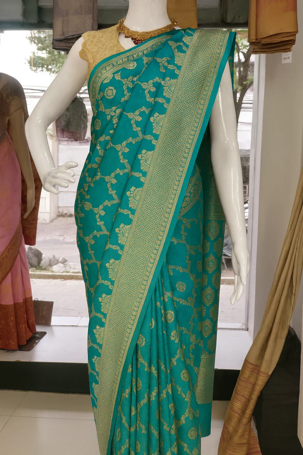 Emerald Green Banarasi Silk Saree with Intricate Golden Zari Floral Weaving